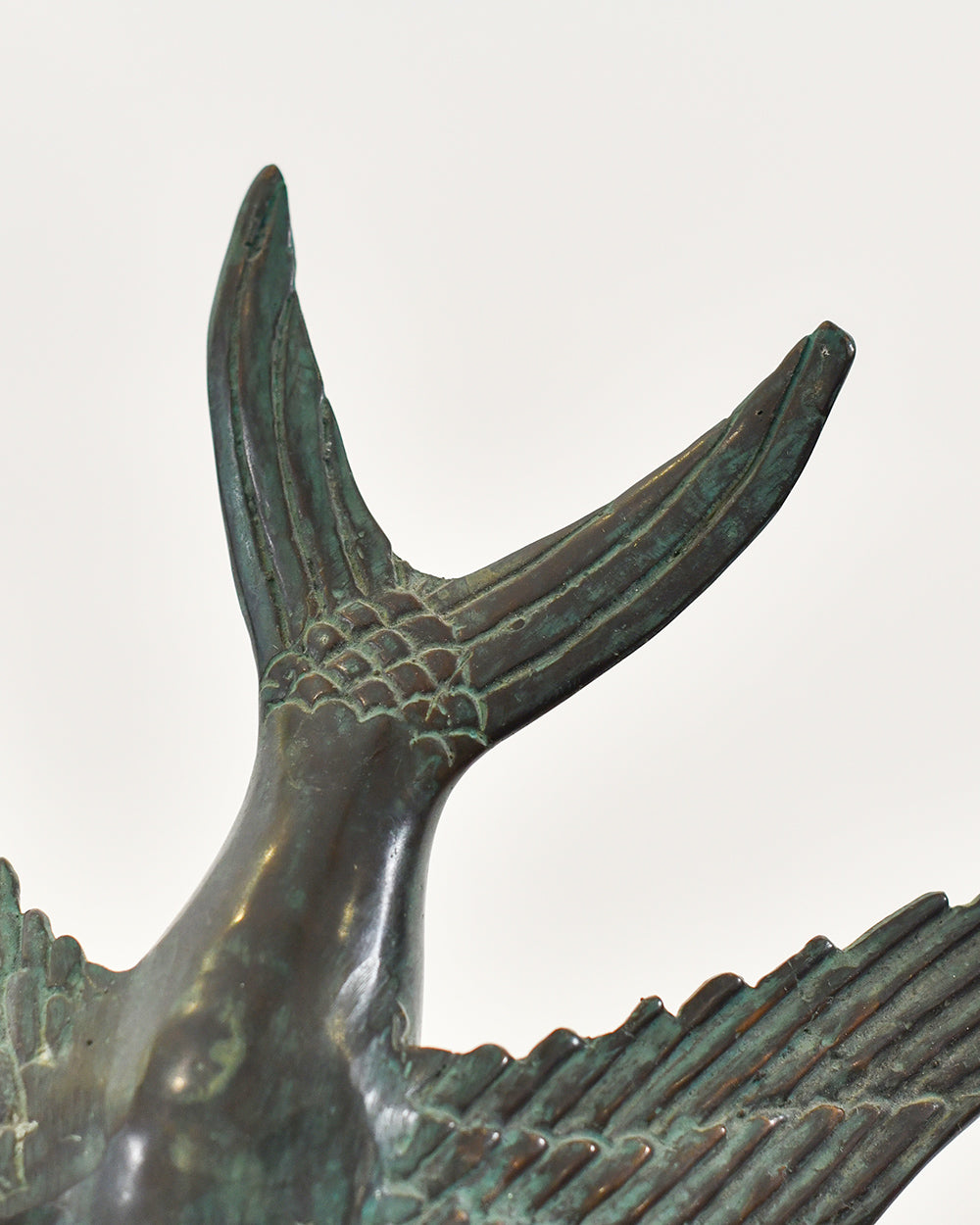 Close Up Of The Finish On The Bronze Gilded Aero Swallow Ornament