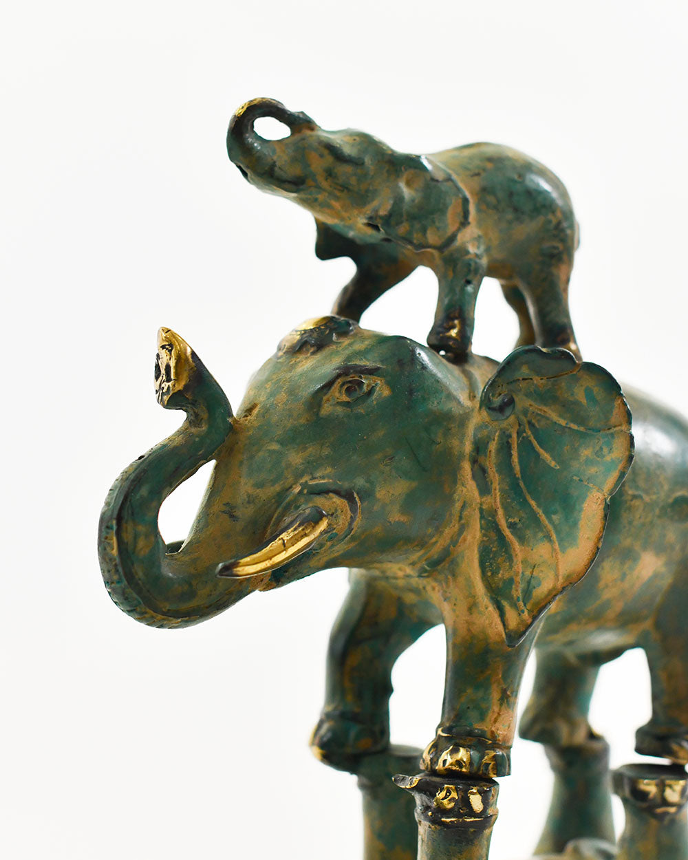 Close Up Of The Verdigris Finish On The Bronze Gilded Acrobat Elephants