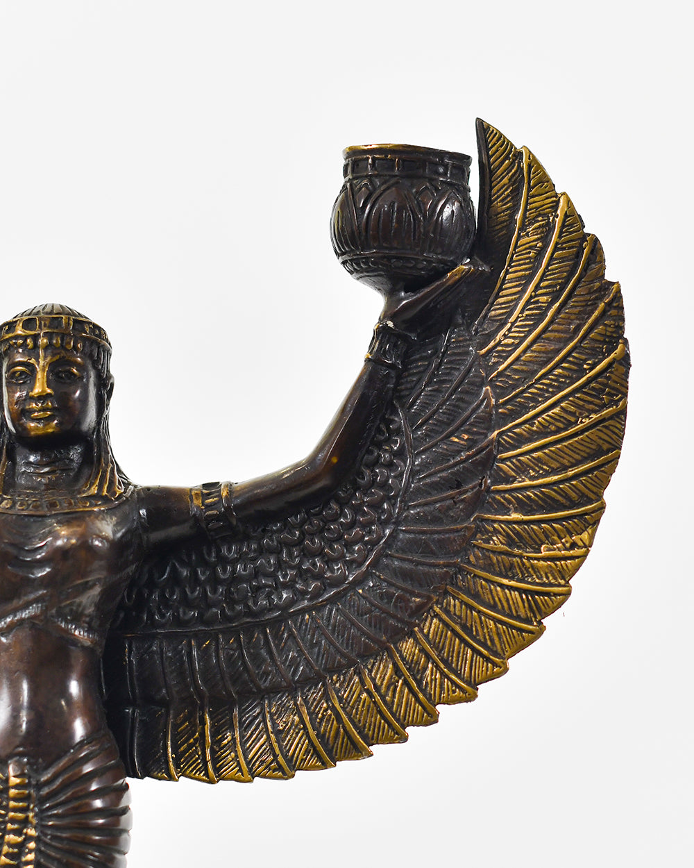 Close up of the bronze statue of a winged godess