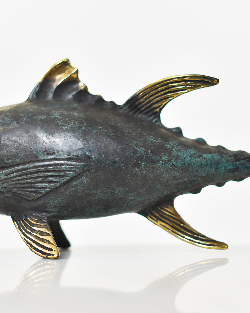 Close Up Of The Ornate Finish On The Bronze Tuna Sculpture