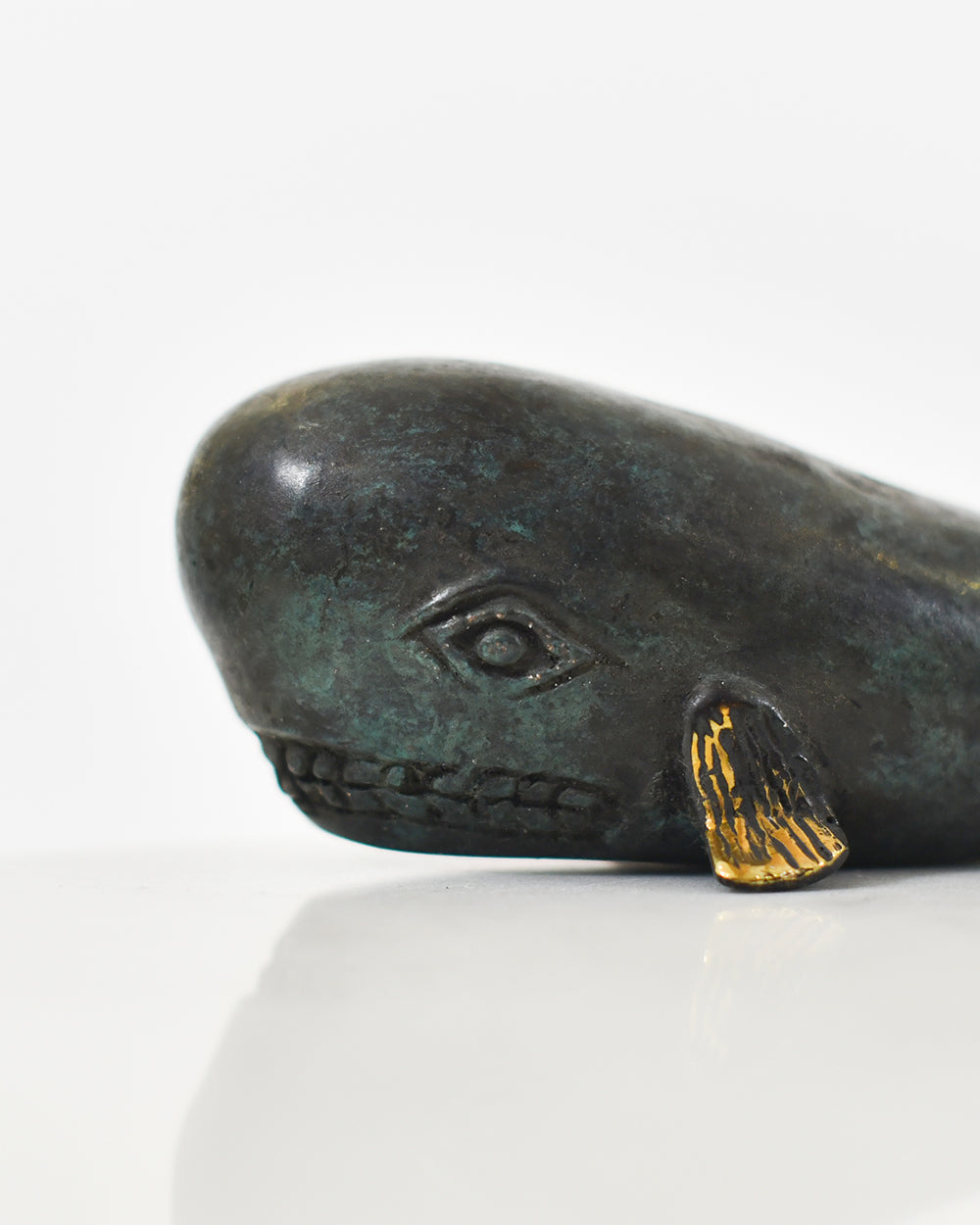 Close Up Of The Broze Whale Ornament