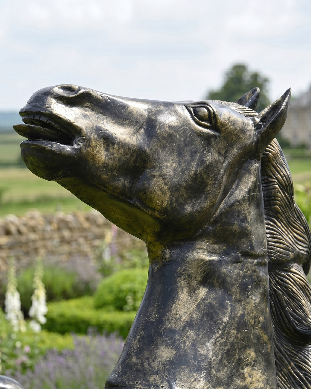Close Up Of The Face From The Black & Gold Horse Sculpture