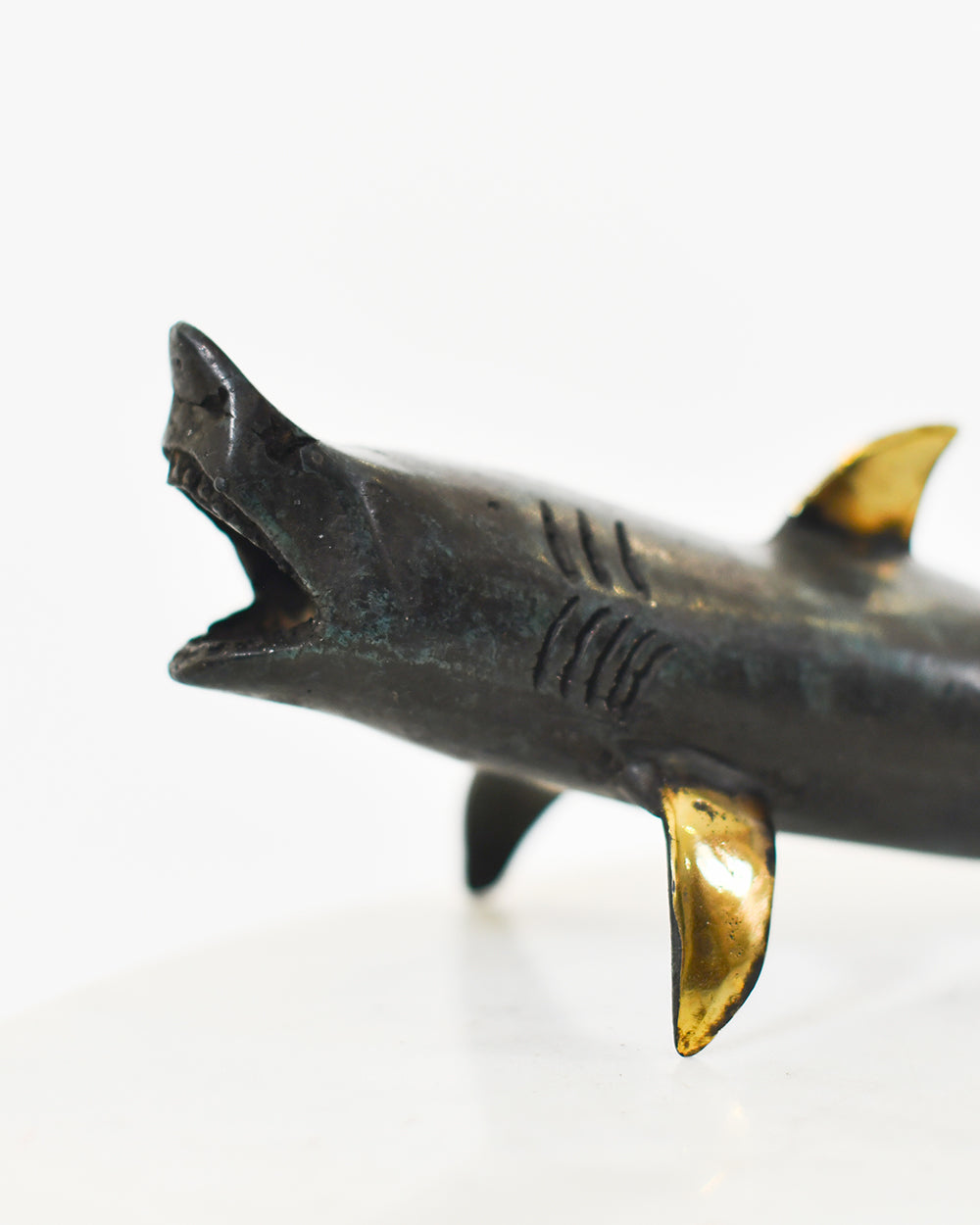 Close Up Of The Bronze Shark Ornament